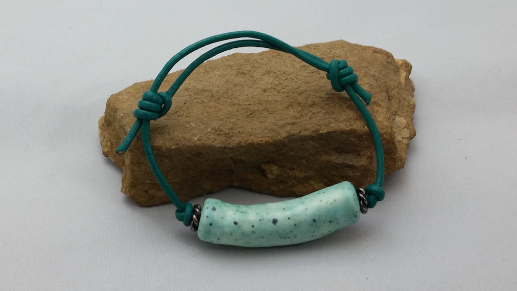 Handmade Ceramic on Green Leather
